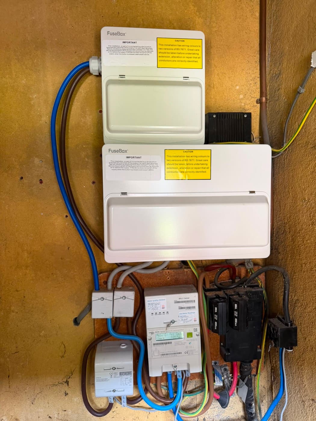 Two FuseBox consumer units fitted above the meter and supply tails