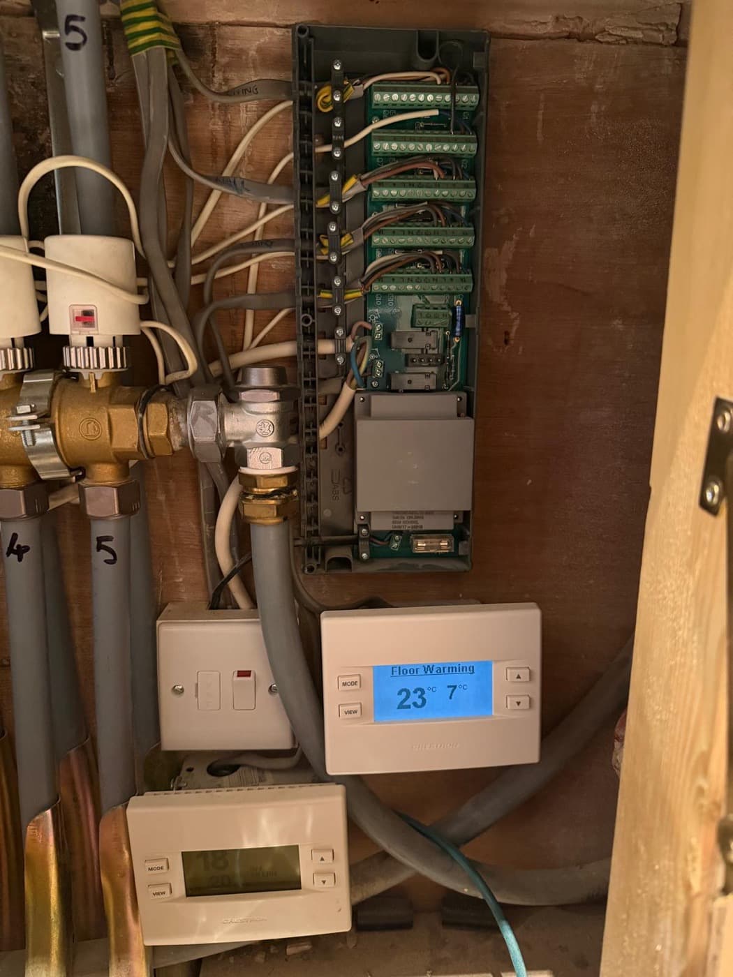 Underfloor heating wiring centre and floor-warming thermostat wired in