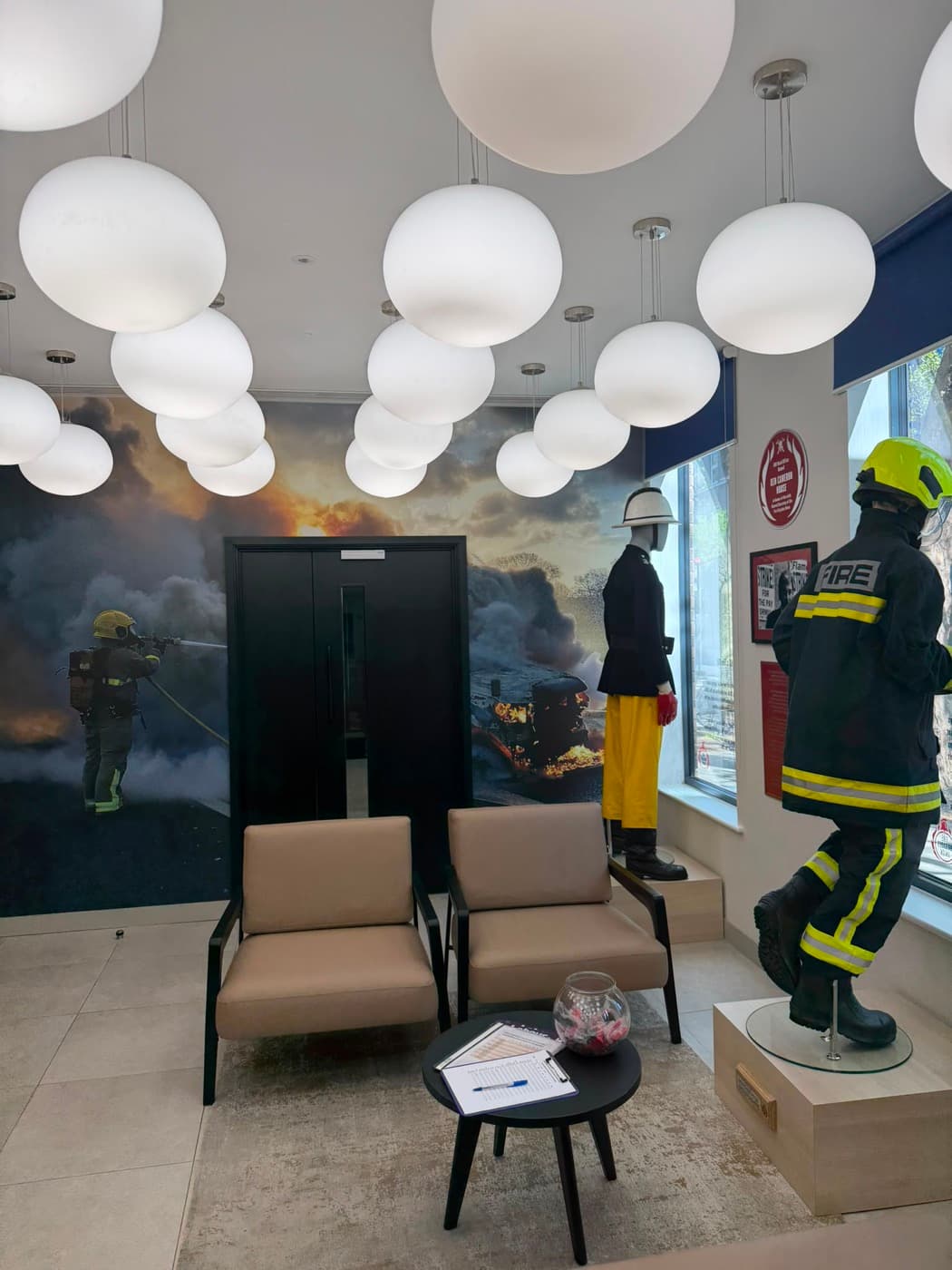 Cluster of white globe pendant lights in a commercial reception