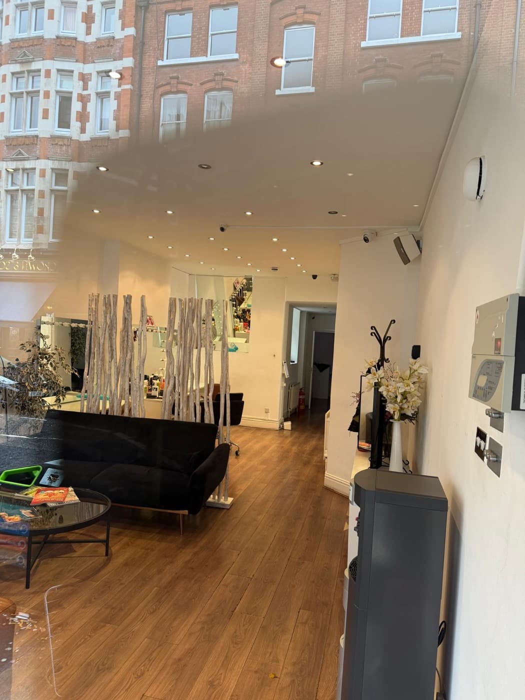 Track spotlights and downlights fitted through a salon
